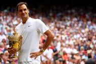 Roger Federer with the Gentlemen's singles trophy